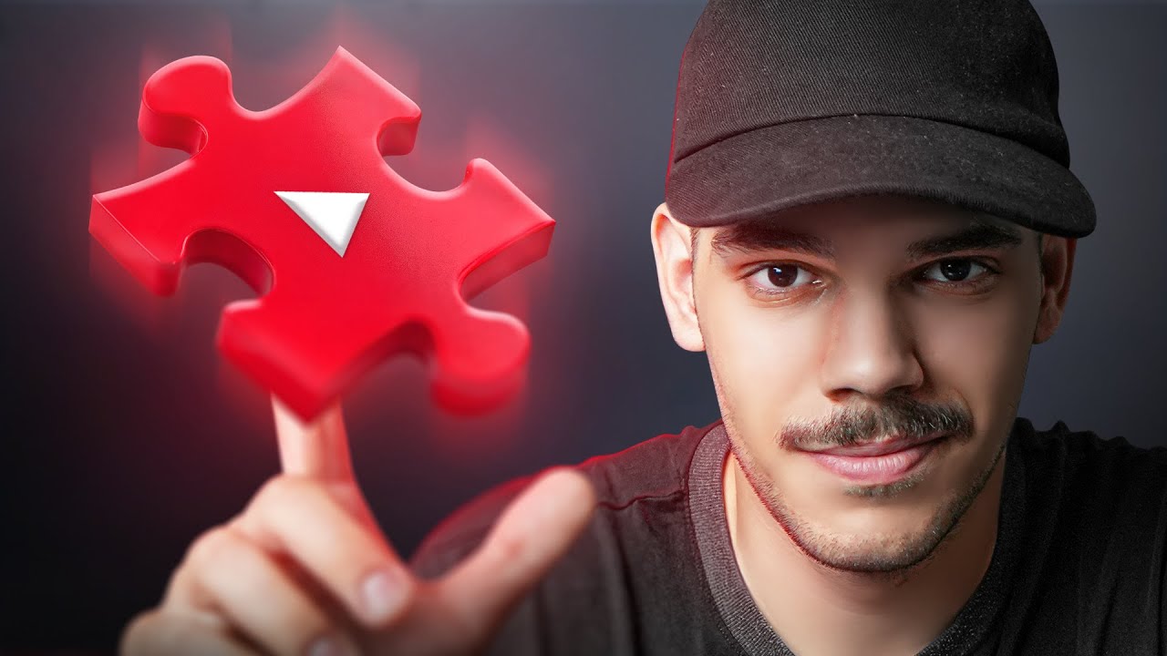 Origin story video cover: a man in a black cap balancing a glowing red YouTube play-button puzzle piece on his fingertip