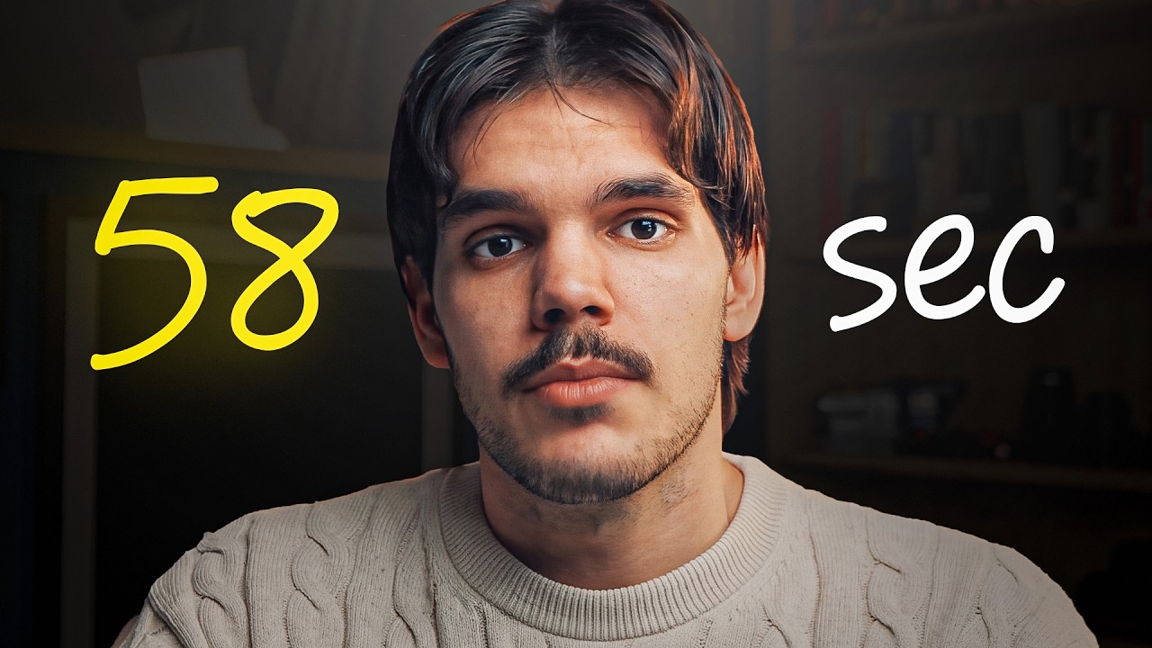 A man in a cream knit sweater looking straight at the camera in a dark room, with 58 in yellow on one side of him and sec in white on the other